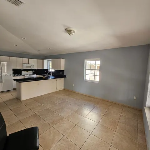 a view of a kitchen with a sink
