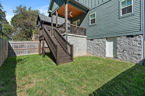 a balcony with trees in front of it