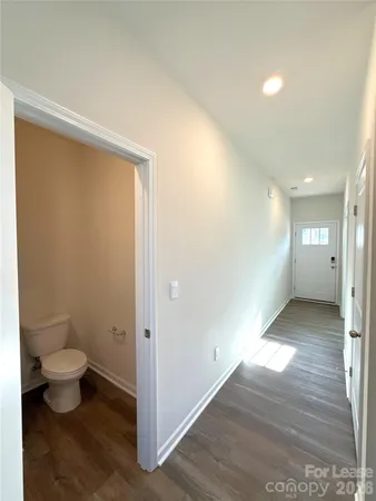 a view of a bathroom with toilet sink and mirror