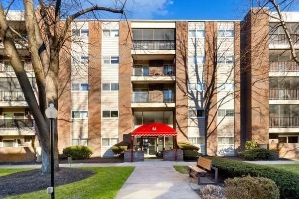 a view of a building with a yard