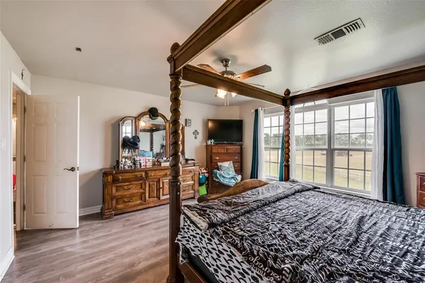 a living room with a large bed furniture and a large window