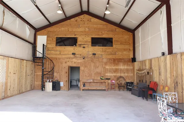 a view of a patio with table and chairs