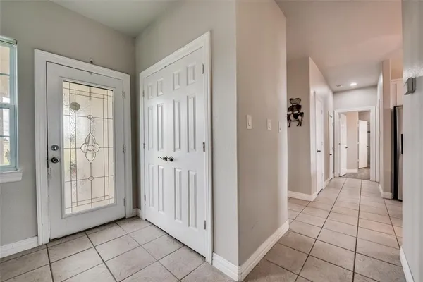 a view of a hallway with closet area