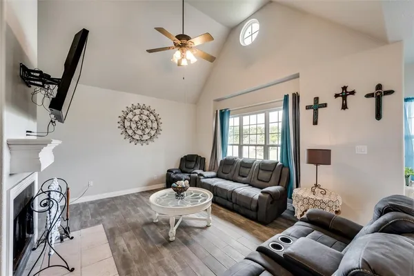 a living room with furniture a couch and a chandelier