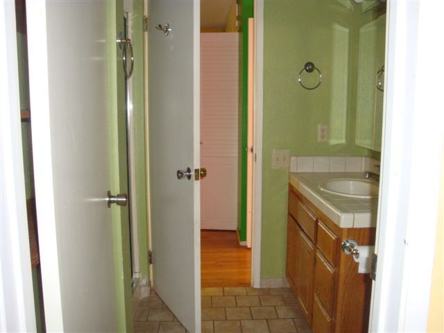 2707 Irwin Road Redding, CA 96002 - Photo 8 of 12 a bathroom with a sink and a mirror