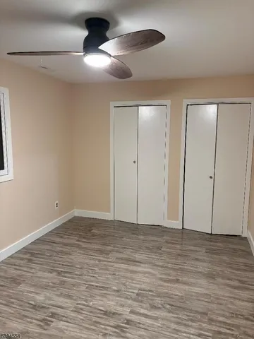 a view of room with wooden floor