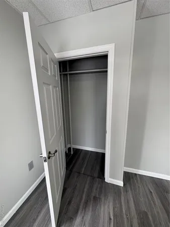 an entryway with wooden floor and staircase