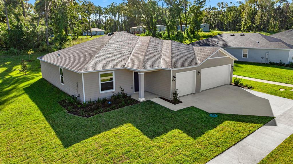 4597 Southwest 81st Loop Ocala, FL 34476 - Photo 5 of 6 an aerial view of a house with a yard
