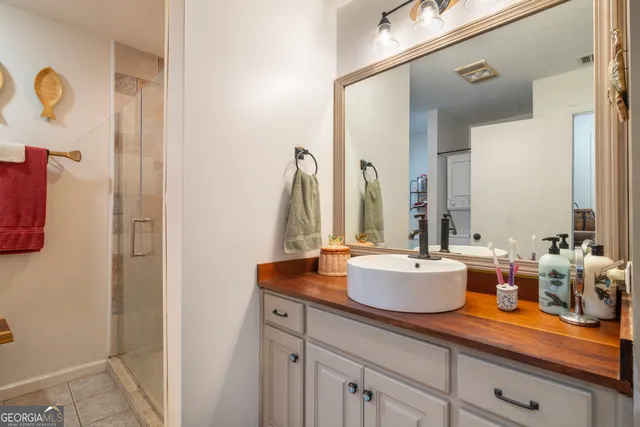 a kitchen with sink and a mirror