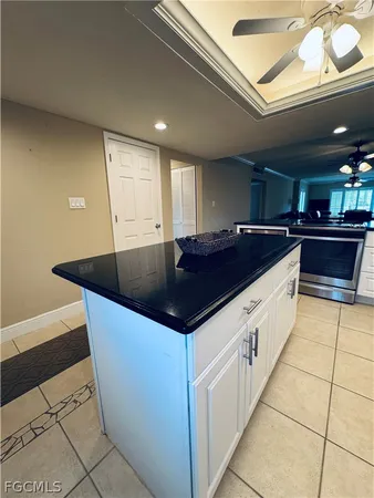 a kitchen with stainless steel appliances granite countertop a sink a counter space and cabinets