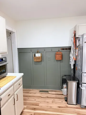 a view of a kitchen with appliances and cabinets