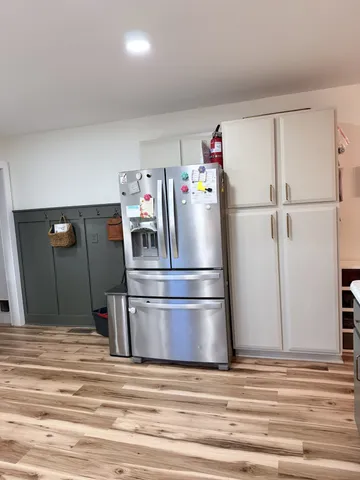 a refrigerator freezer sitting inside of a kitchen