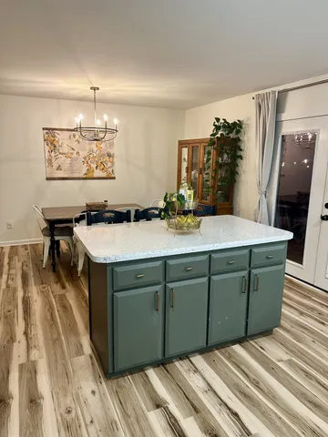 a room with a sink and a mirror