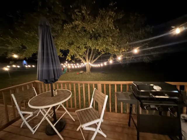 a view of a chairs and table in patio