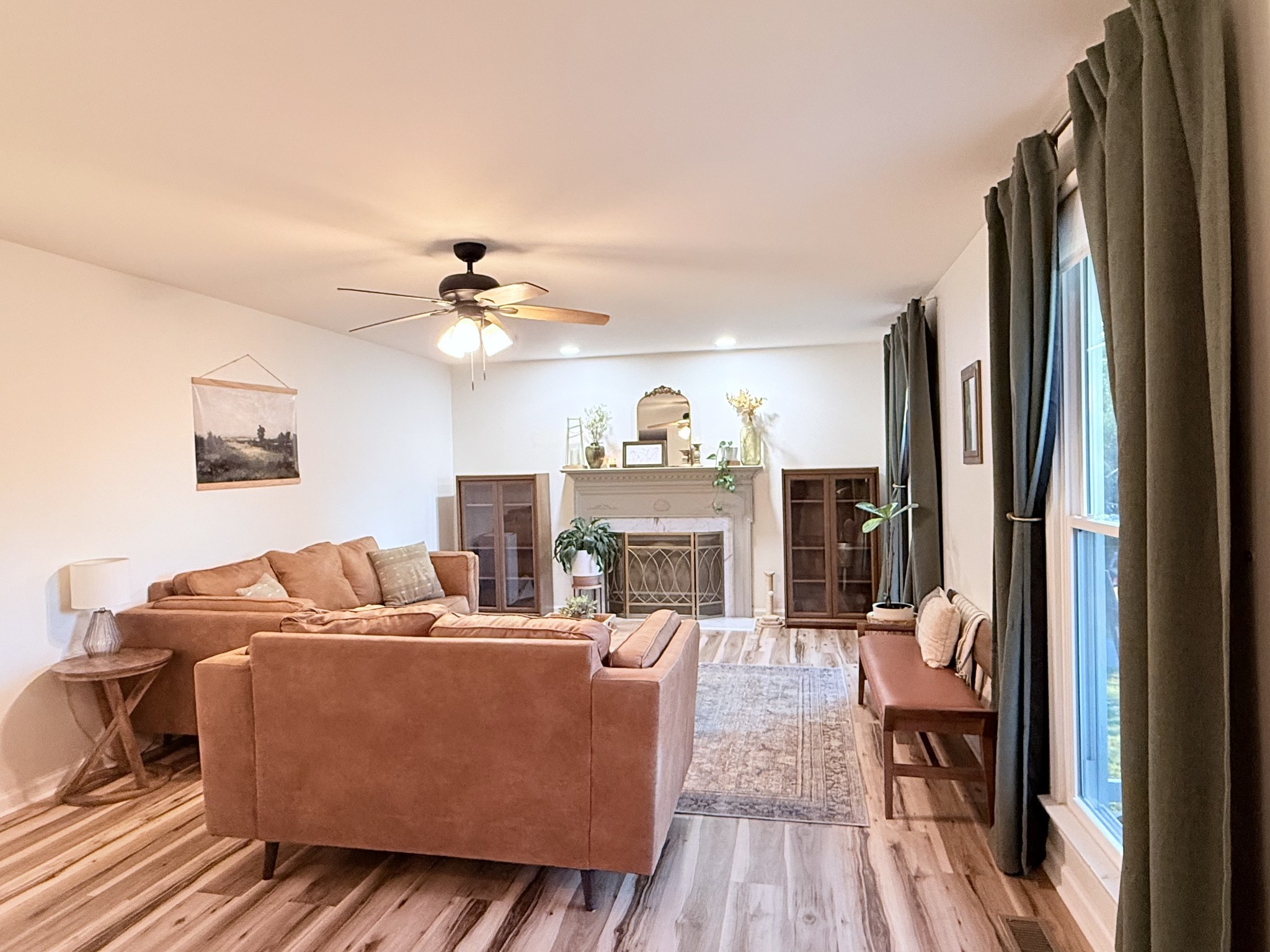 6023 Wayman Dunn Road Springfield, TN 37172 - Photo 9 of 38 a living room with furniture and a fireplace