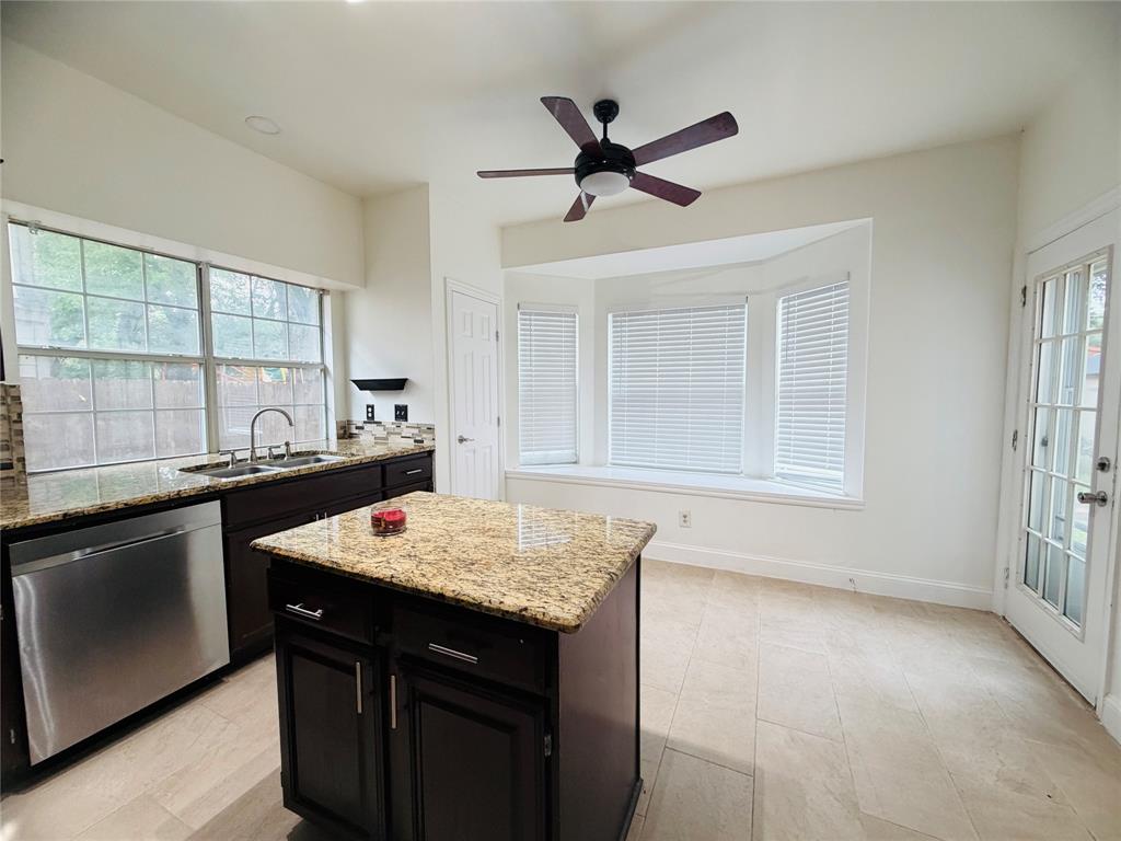 434 Moonlight Way Irving, TX 75063 - Photo 9 of 29 a kitchen with a sink stove and cabinets