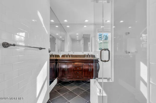 a living room with a bed furniture and a wooden floor