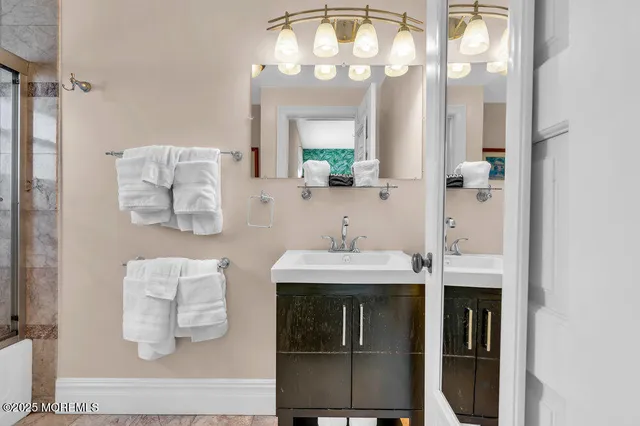 a spacious bedroom with two beds and a table