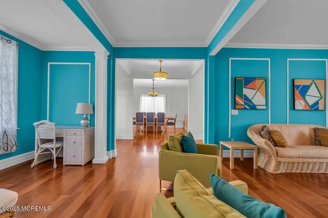 a living room with furniture and a lamp