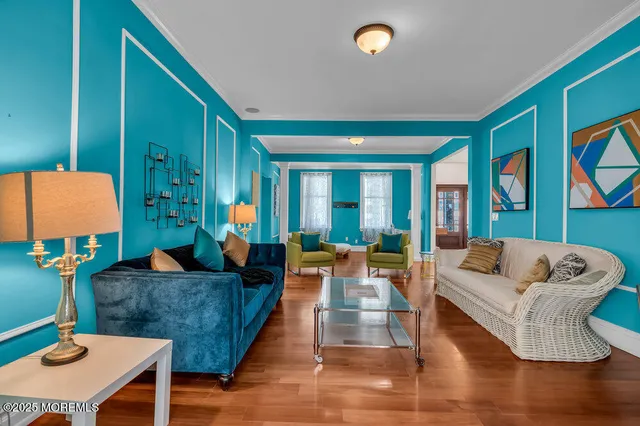a view of a dining room with furniture and wooden floor