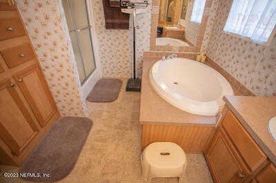 7169 Gas Line Road Keystone Heights, FL 32656 - Photo 29 of 31 a bathroom with a sink and mirror
