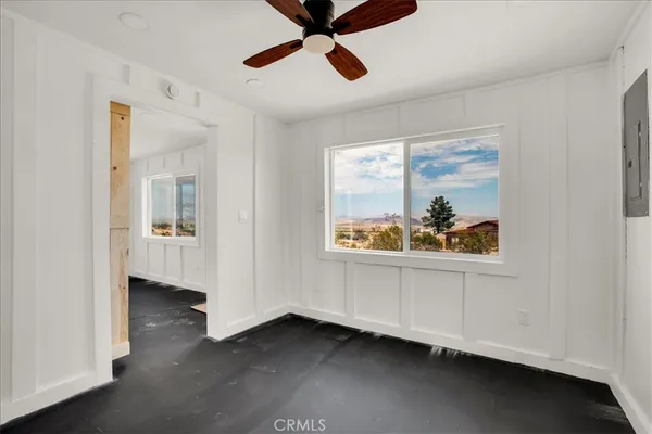a view of an entryway with wooden floor
