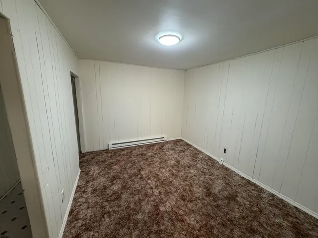 an empty room with a hallway