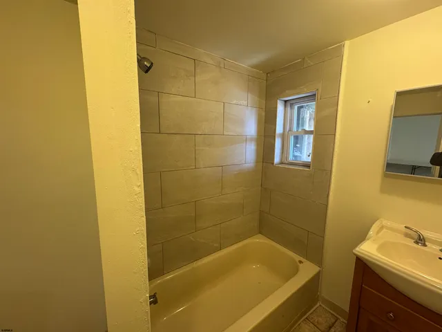 a bathroom with a sink and a bathtub