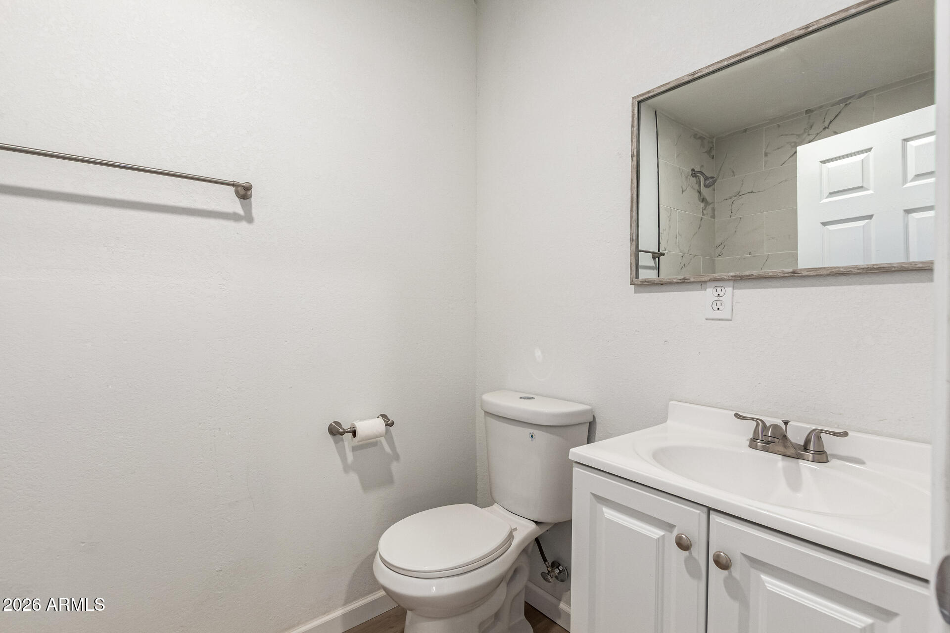 411 West Bealey Avenue Coolidge, AZ 85128 - Photo 18 of 26 a bathroom with a toilet sink and mirror