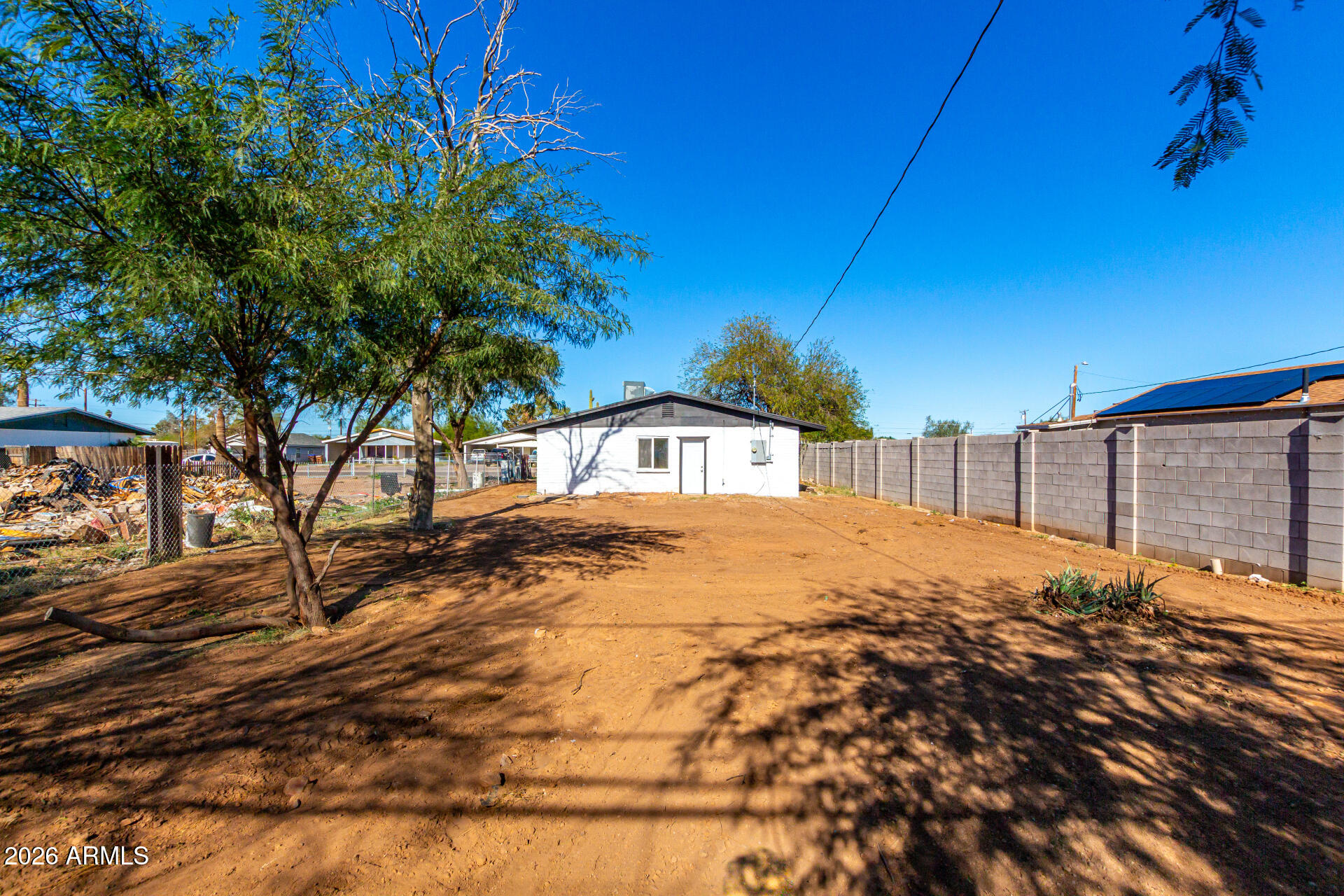 411 West Bealey Avenue Coolidge, AZ 85128 - Photo 22 of 26 a view of a backyard of the house