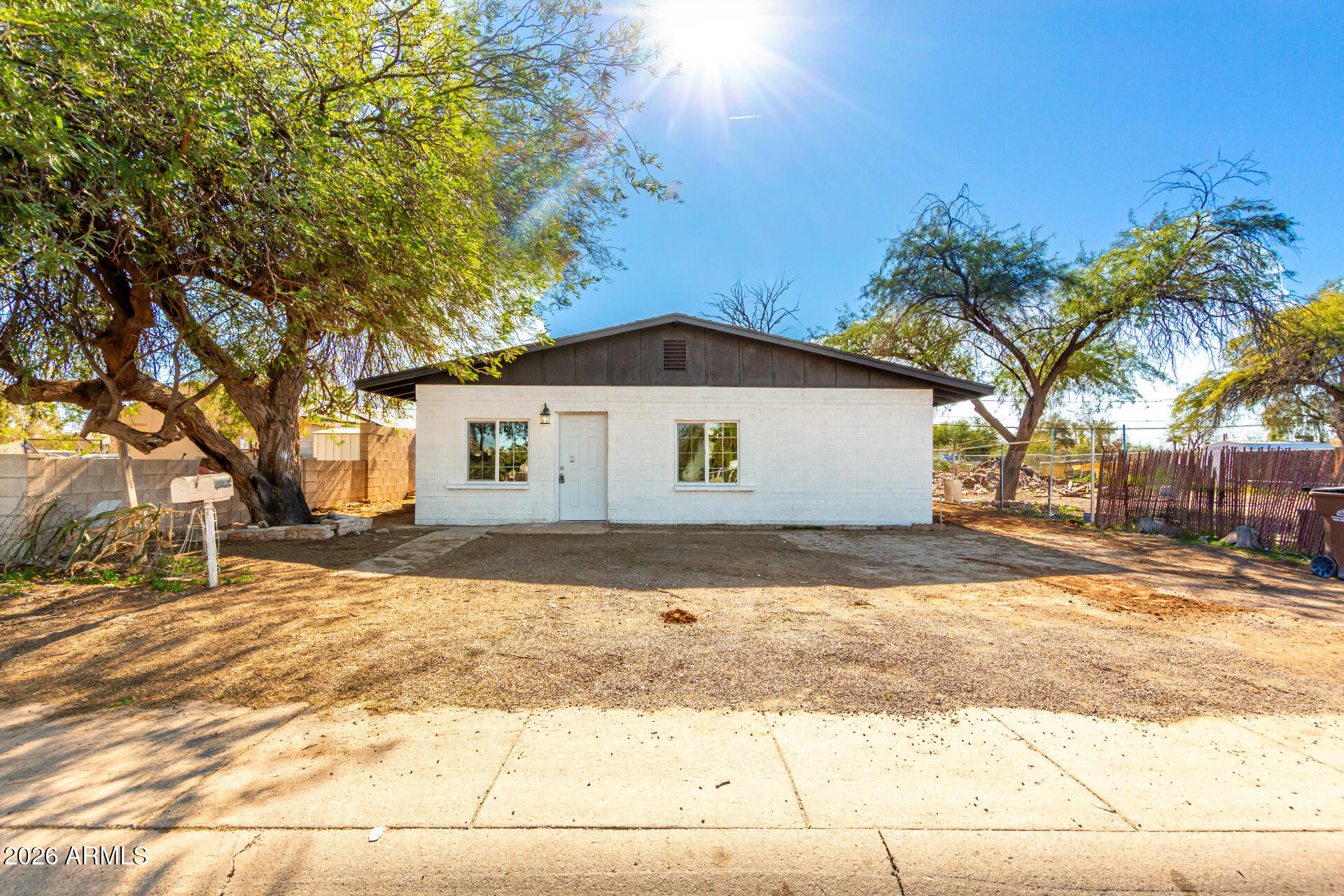 411 West Bealey Avenue Coolidge, AZ 85128 - Photo 24 of 26 a front view of a house with a yard