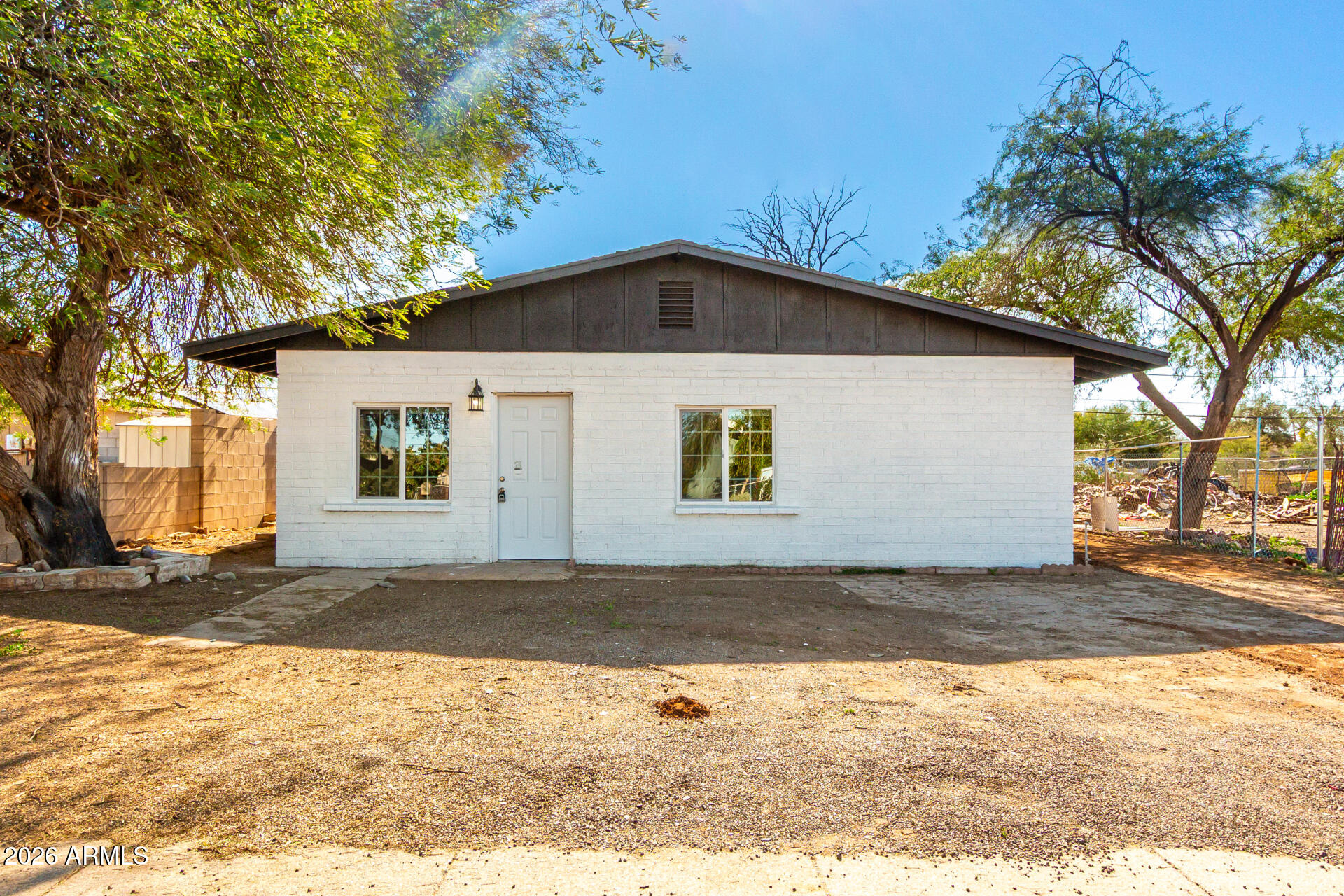 411 West Bealey Avenue Coolidge, AZ 85128 - Photo 25 of 26 a front view of a house with a yard