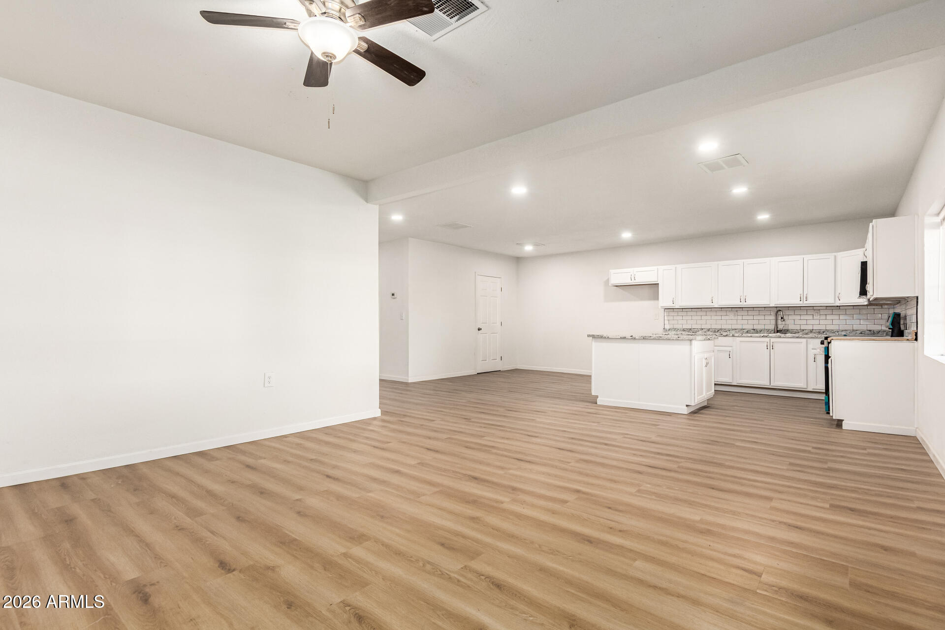411 West Bealey Avenue Coolidge, AZ 85128 - Photo 6 of 26 a view of kitchen with wooden floor