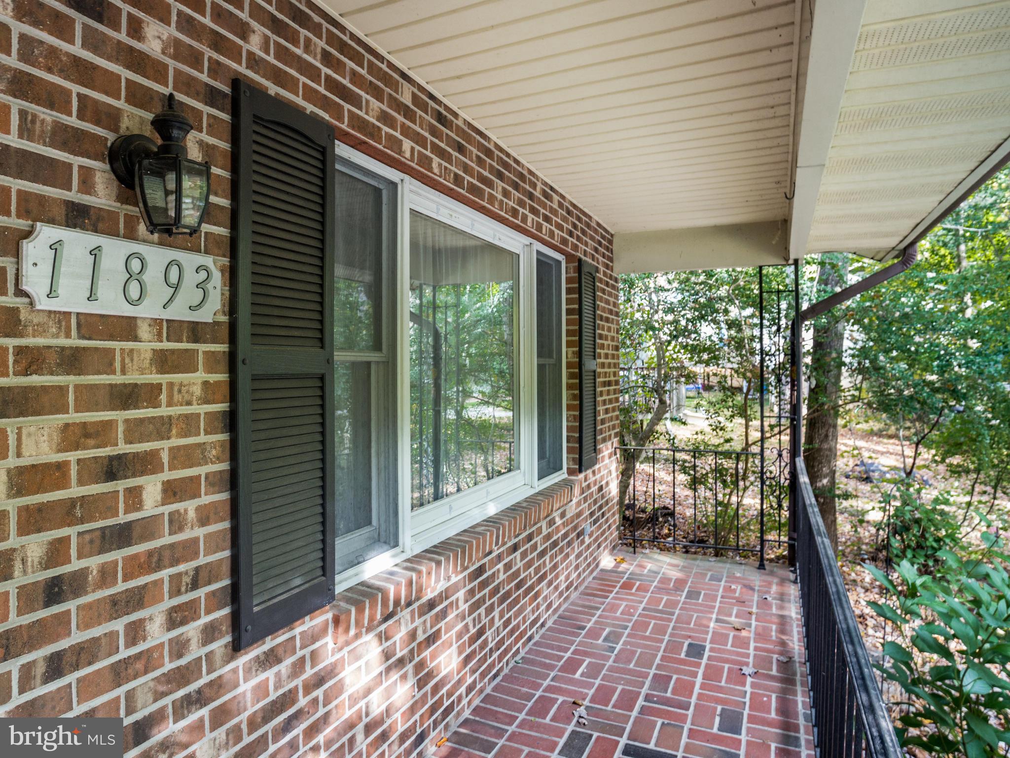 11893 Little Cove Point Road Lusby, MD 20657 - Photo 2 of 18 a porch with view of outdoor space