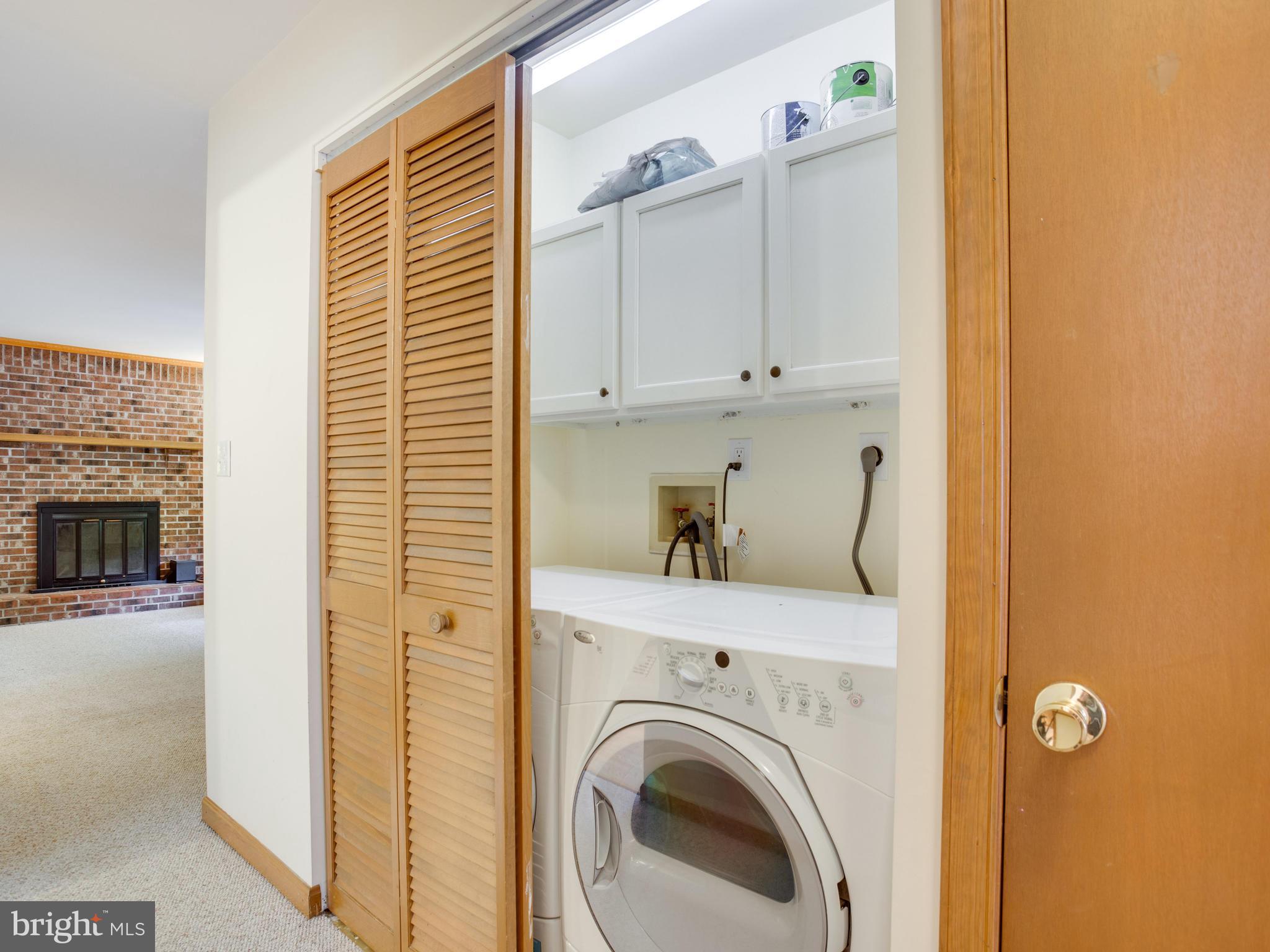 11893 Little Cove Point Road Lusby, MD 20657 - Photo 11 of 18 a view of washer and dryer in a kitchen