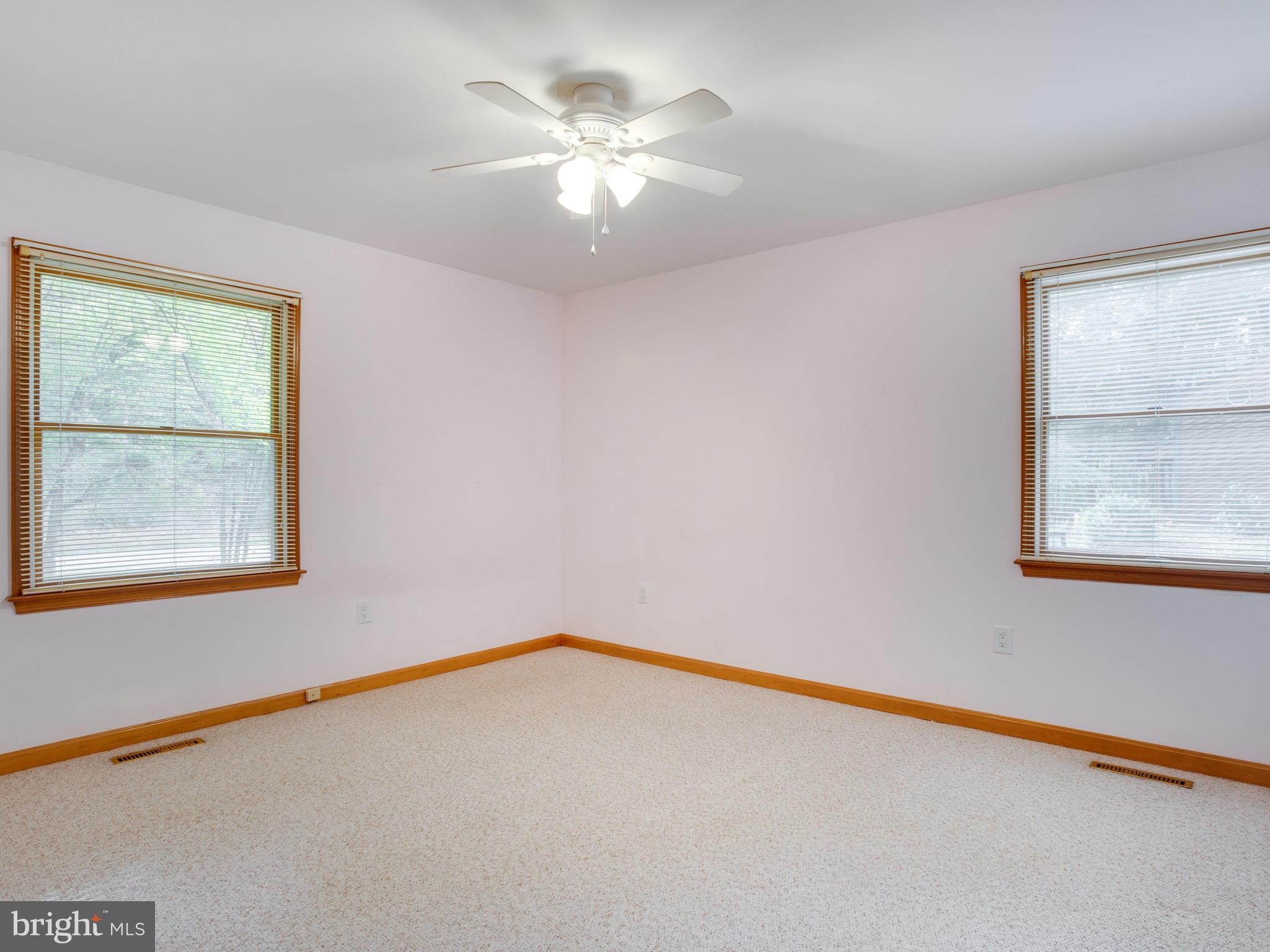 11893 Little Cove Point Road Lusby, MD 20657 - Photo 13 of 18 a view of an empty room with a window