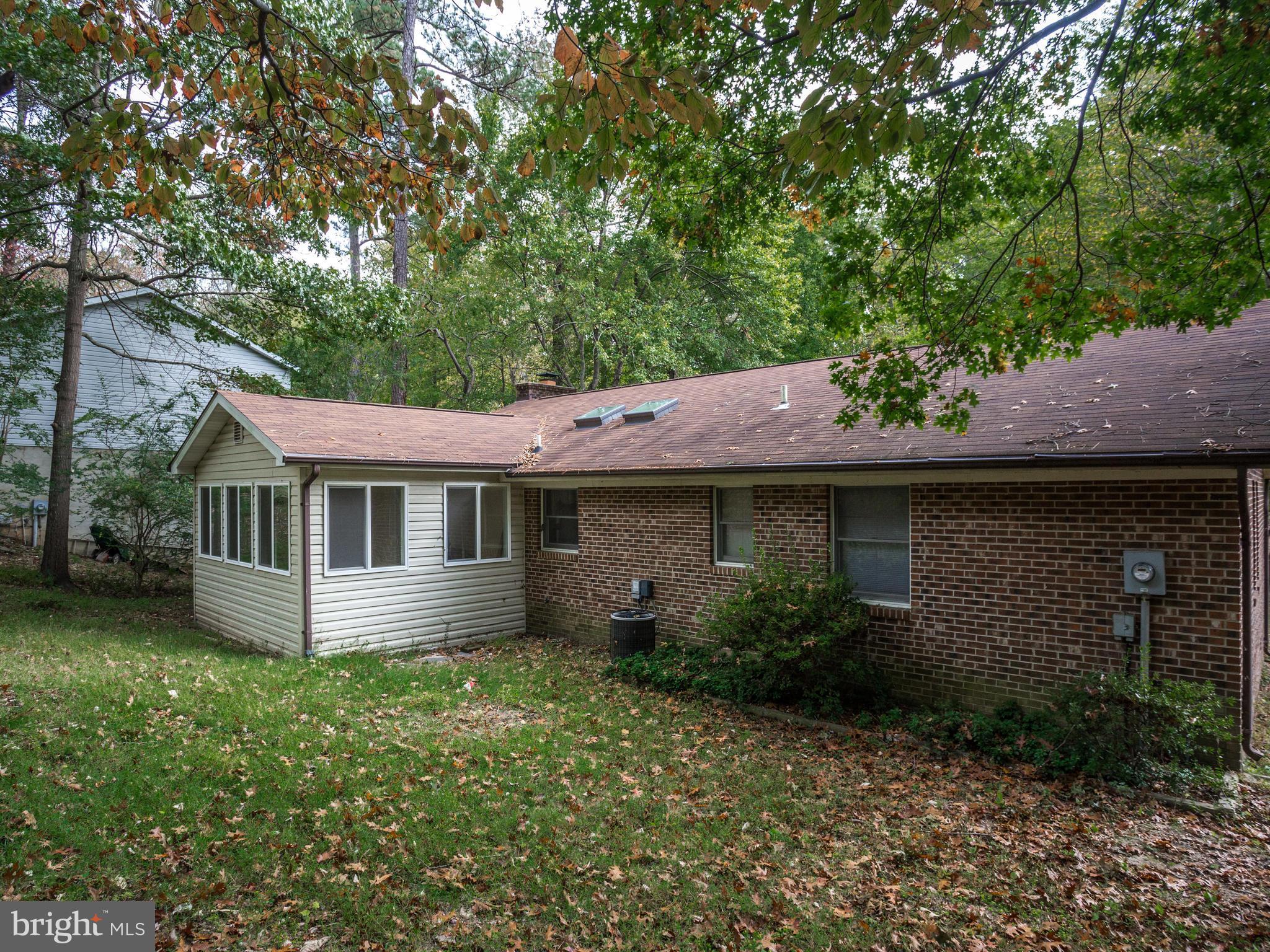 11893 Little Cove Point Road Lusby, MD 20657 - Photo 14 of 18 a backyard of a house with lots of green space