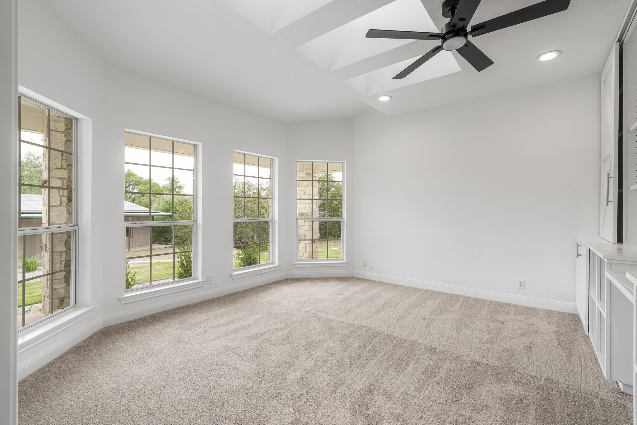 1129 Cedar Pass Road Driftwood, TX 78619 - Photo 17 of 40 This office space is incredible. You have those bright skylights overhead here as well and a wall of windows that keep you inspired all day.
