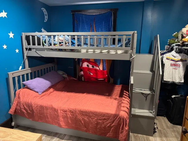 a bedroom with a bed and dresser