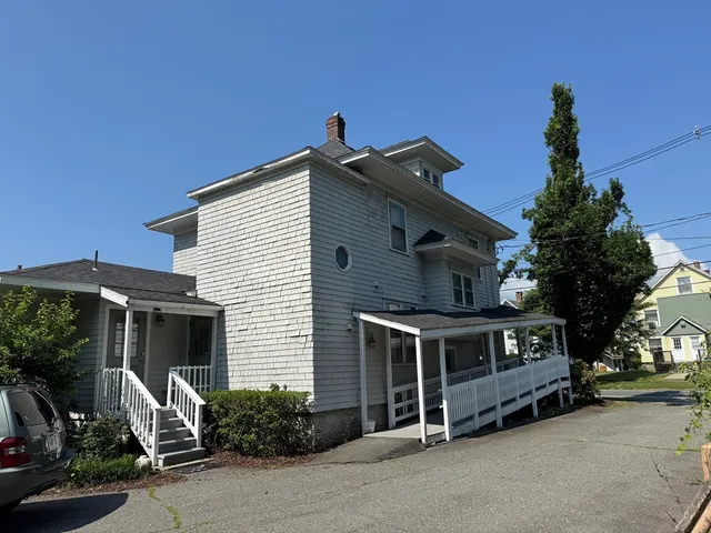 a front view of a house with garage