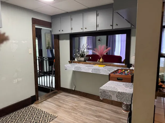 a kitchen with a refrigerator and a stove