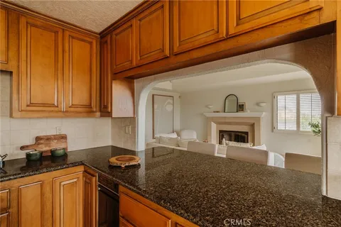 a kitchen with a sink stove and refrigerator