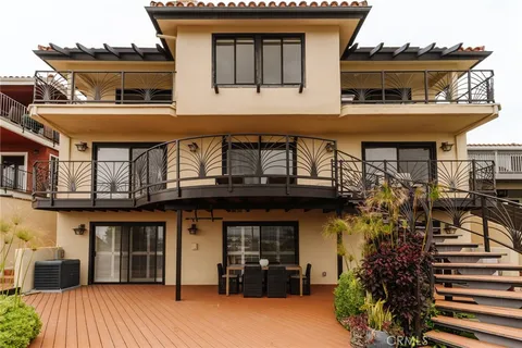 a front view of a house with lots of green space