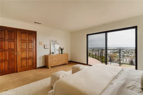 a bathroom with double vanity sinks and a mirror