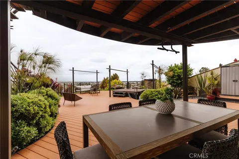 a view of a balcony and chairs