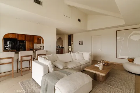 a living room with furniture and a view of living room