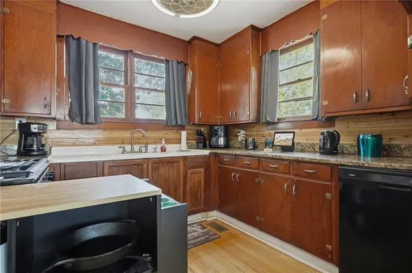 a kitchen with a stove and a microwave