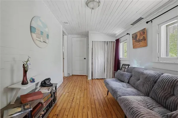 a bedroom with a bed a table and chair