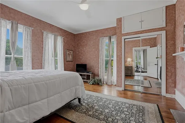 a bedroom with a bed and a fireplace