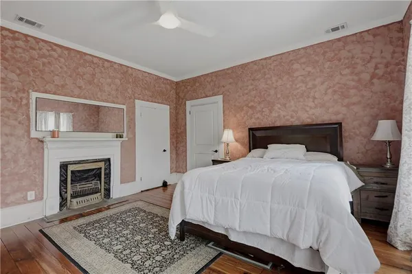 a living room with furniture windows and a flat screen tv